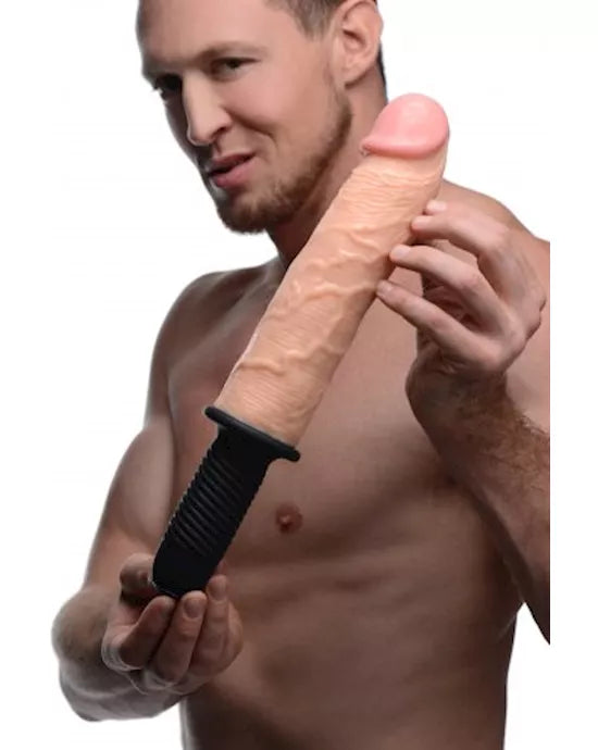 a naked man holding a huge silicone Dildo
